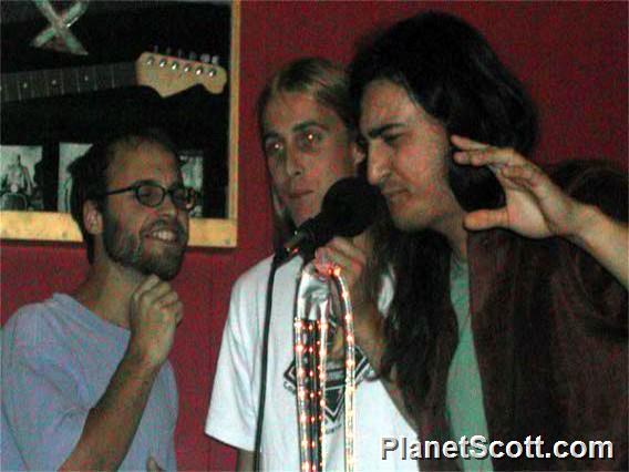 Damien, Derek, and Mark do karaoke