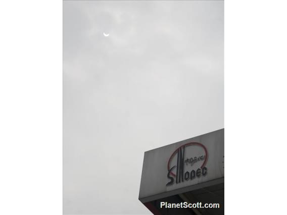 Partial Phase of Solar Eclipse Over Sinopec Station