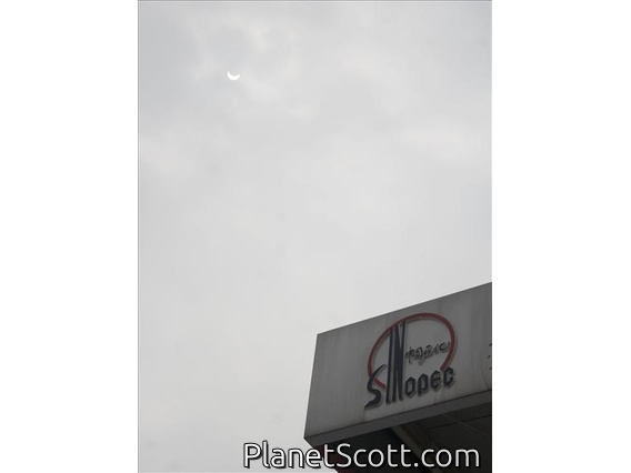 Partial Phase of Solar Eclipse Over Sinopec Station